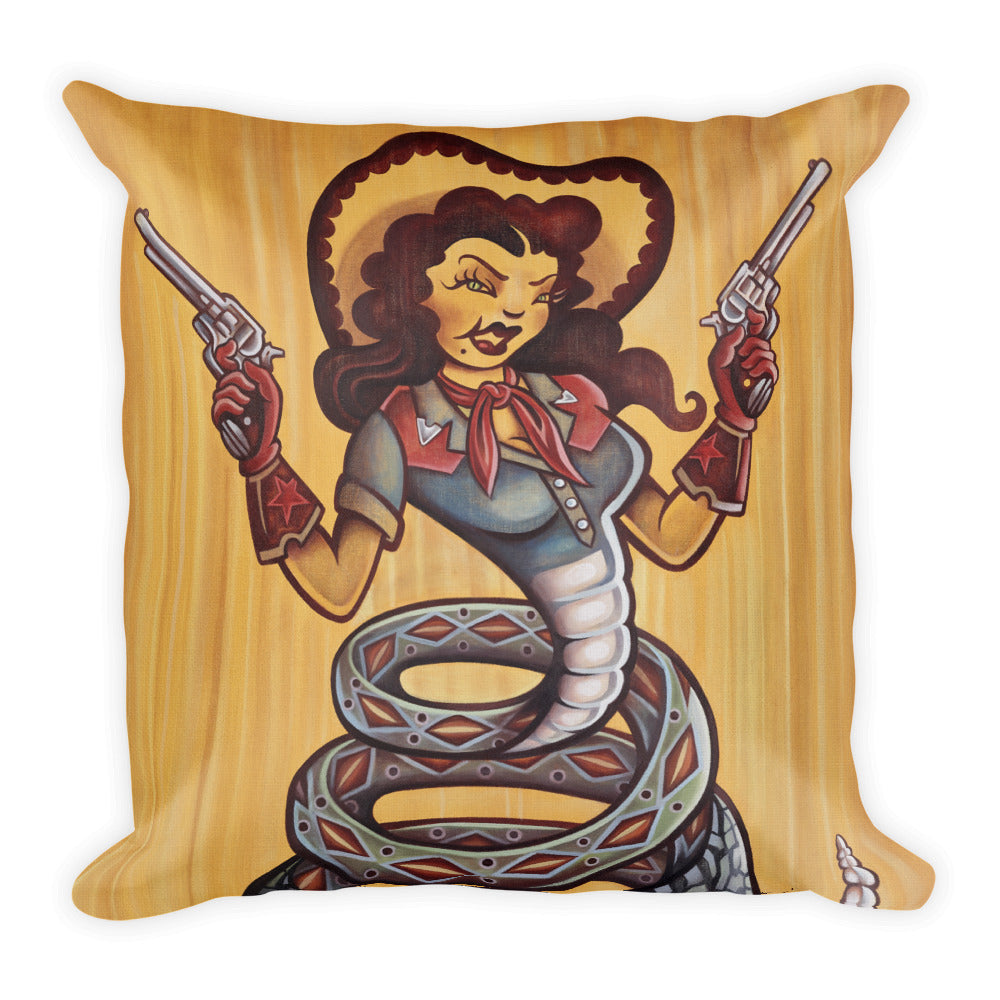 Cowgirl Pillow - Choice Goods Gallery. Cowgirl with six shooters wearing red gloves and cowboy hat, western shirt with a red bandana. She has a snake body with a rattlesnake tail. Green snake eyes and dark hair, on a gold yellow background
